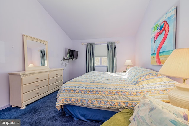 bedroom with carpet floors and vaulted ceiling