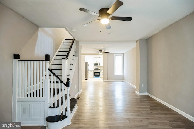 interior space featuring ceiling fan and hardwood / wood-style floors