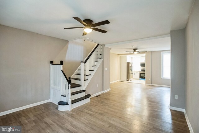 interior space with light hardwood / wood-style floors and ceiling fan