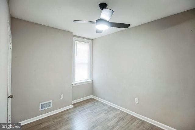 unfurnished room with light hardwood / wood-style flooring and ceiling fan