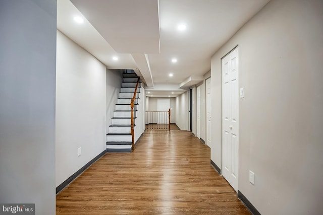 basement with hardwood / wood-style flooring