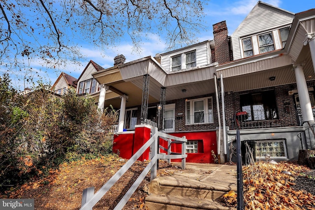 townhome / multi-family property with covered porch