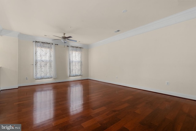 spare room featuring ceiling fan, ornamental molding, and dark wood-type flooring