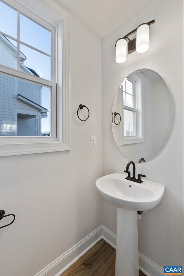 bathroom with hardwood / wood-style flooring