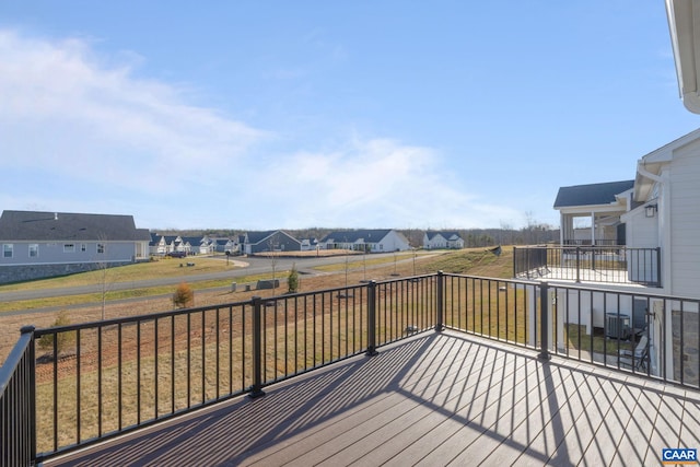 wooden terrace featuring cooling unit