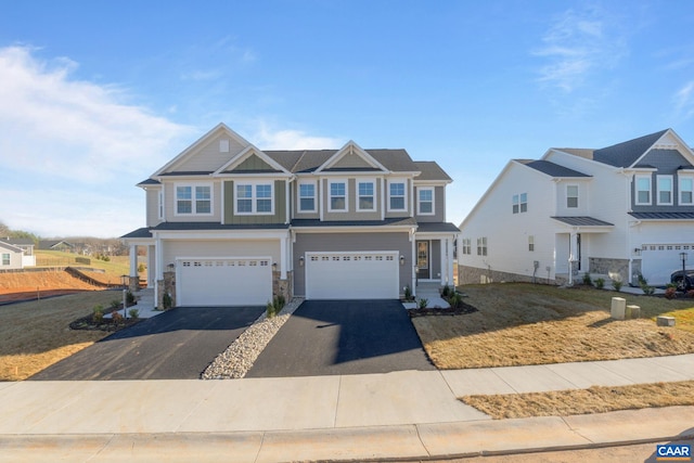 view of front of property featuring a garage and a front lawn