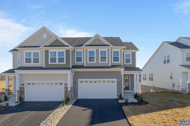 view of front of home with a garage and a front lawn