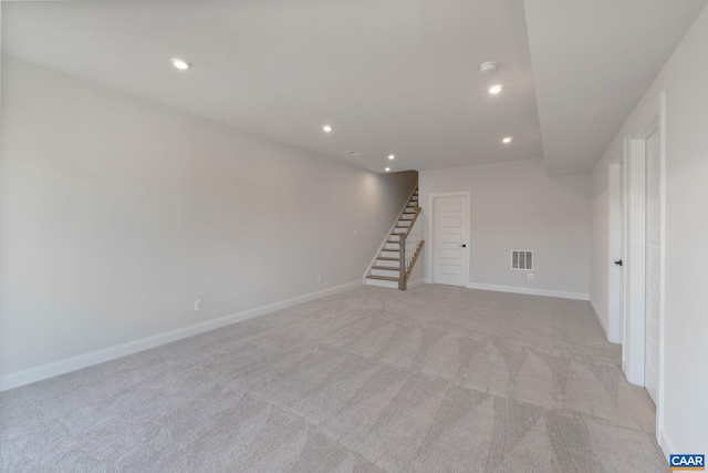 interior space featuring light colored carpet