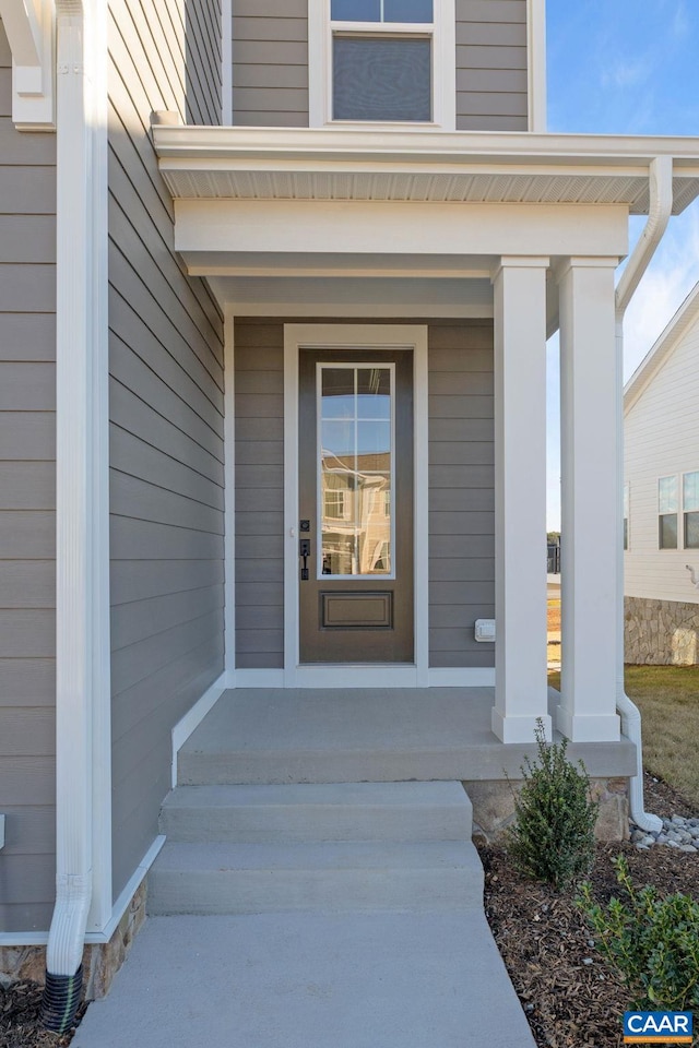 doorway to property with covered porch