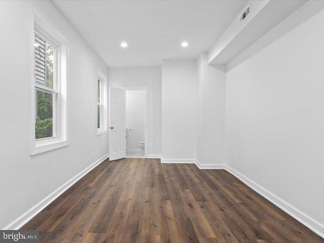 unfurnished room featuring dark hardwood / wood-style floors