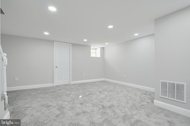 basement with light colored carpet