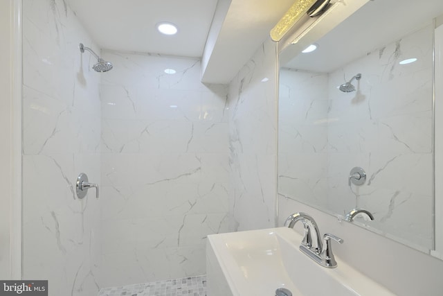 bathroom featuring sink and tiled shower