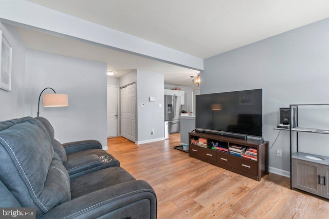 living room with light hardwood / wood-style floors