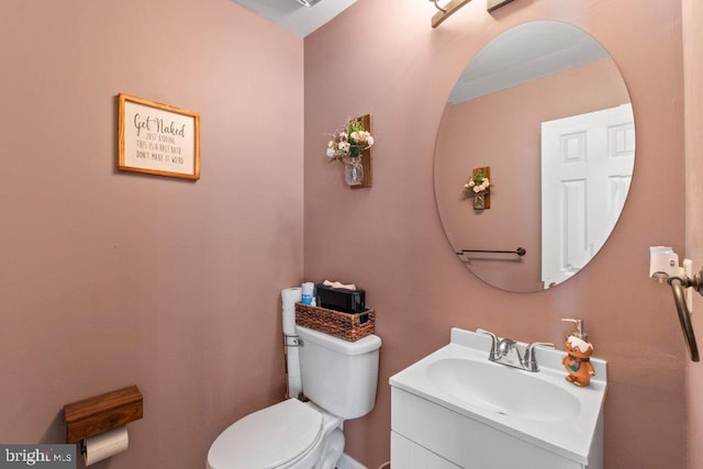 bathroom with toilet and vanity