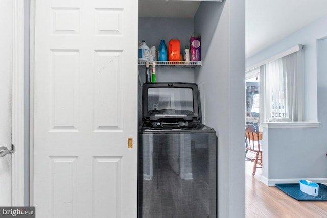 laundry area featuring light hardwood / wood-style floors