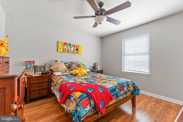 bedroom featuring hardwood / wood-style floors and ceiling fan