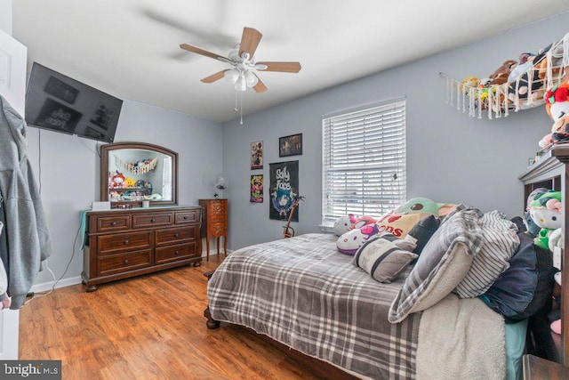 bedroom featuring light wood-type flooring and ceiling fan