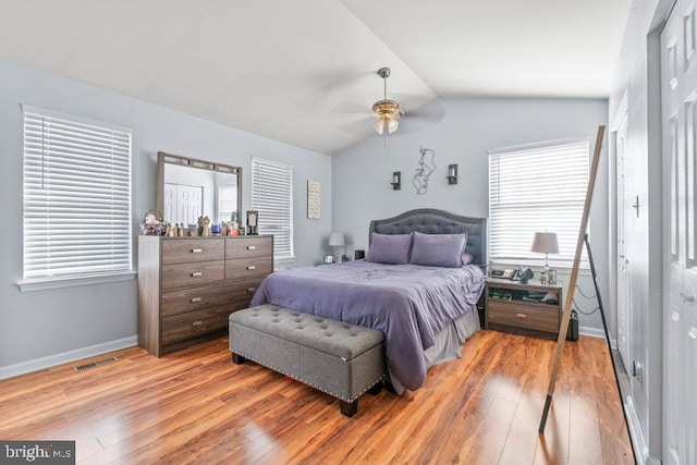 bedroom with lofted ceiling, hardwood / wood-style flooring, and ceiling fan