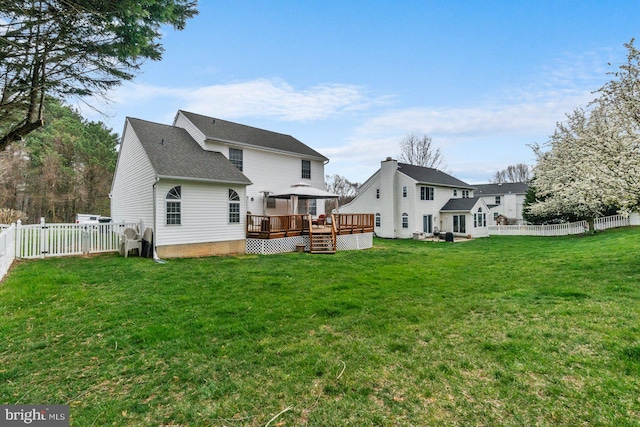 back of house featuring a gazebo, a wooden deck, and a yard