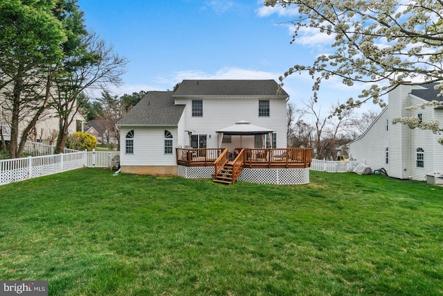 rear view of property with a gazebo and a lawn