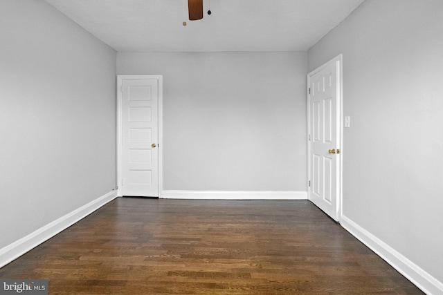 empty room featuring dark hardwood / wood-style floors and ceiling fan