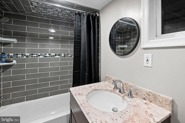 bathroom featuring vanity and shower / tub combo