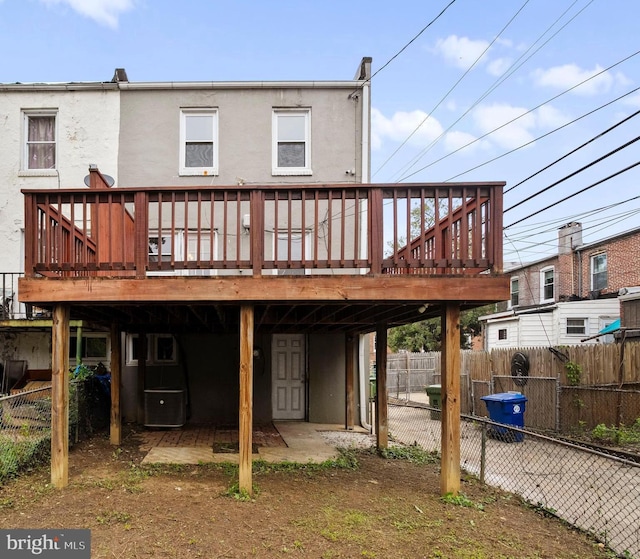 back of house featuring a deck