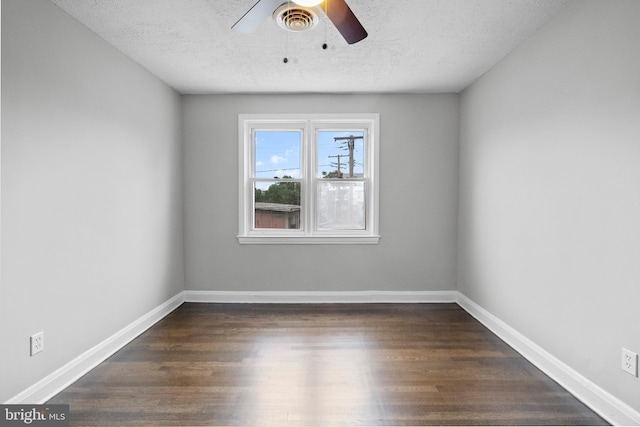 unfurnished room with ceiling fan, dark hardwood / wood-style floors, and a textured ceiling