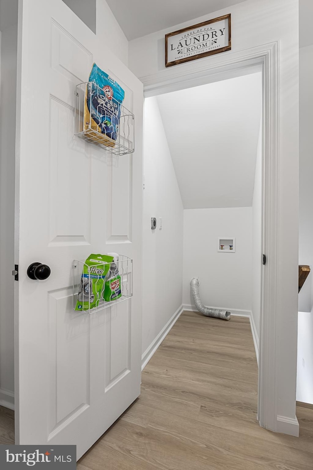 laundry room with washer hookup, light hardwood / wood-style flooring, and electric dryer hookup