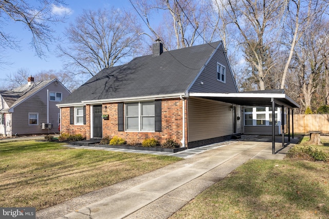 view of front of home featuring a carport and a front lawn