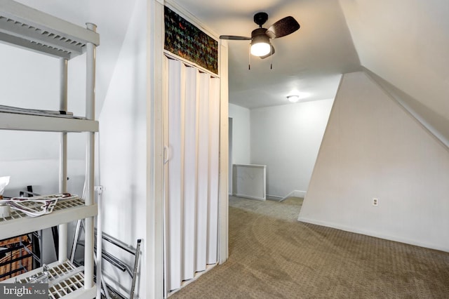 interior space featuring carpet flooring and ceiling fan