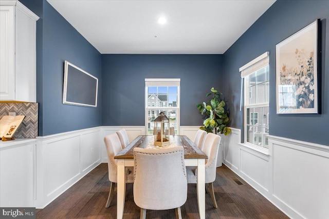 dining area featuring dark hardwood / wood-style floors