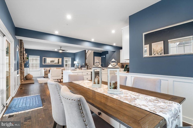 dining area featuring dark wood-type flooring, wine cooler, and ceiling fan