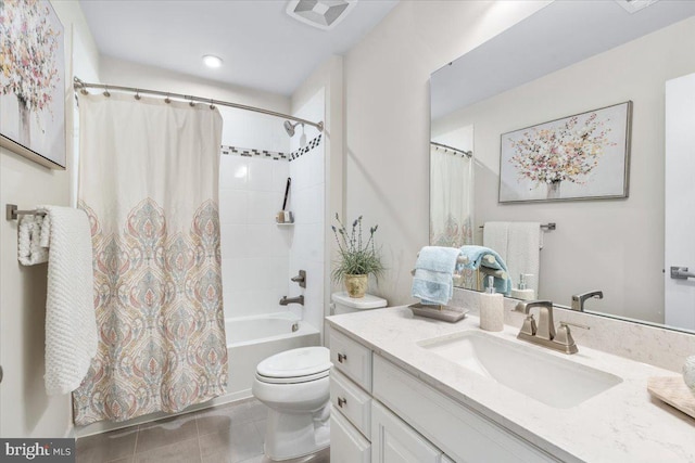 full bathroom featuring toilet, vanity, tile patterned flooring, and shower / tub combo with curtain