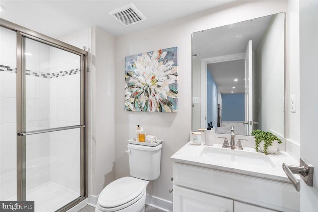 bathroom featuring toilet, walk in shower, and vanity