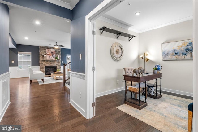 hallway featuring dark hardwood / wood-style floors and crown molding