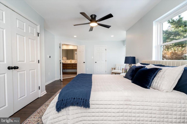 bedroom with ceiling fan, dark hardwood / wood-style flooring, and sink