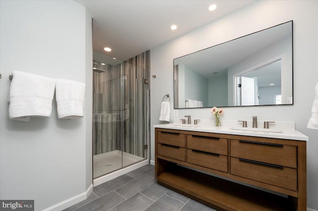 bathroom with tile patterned floors, vanity, and an enclosed shower