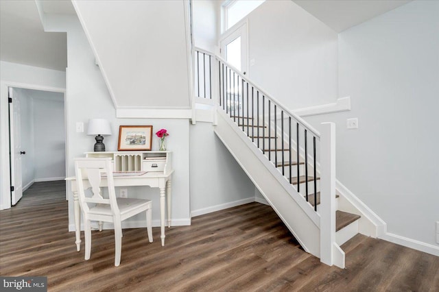 stairs featuring hardwood / wood-style flooring