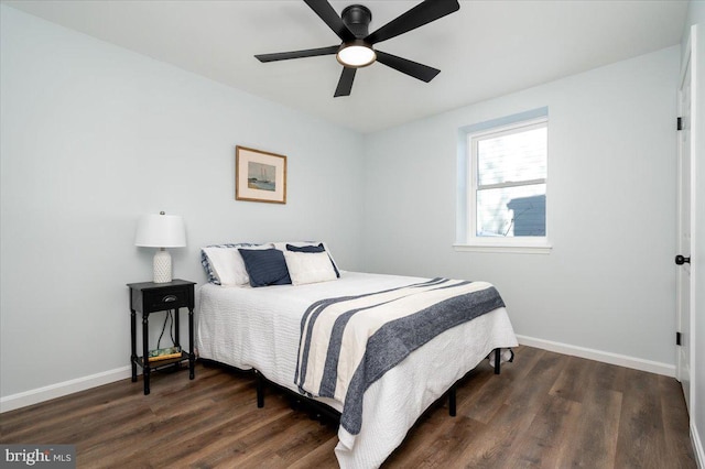 bedroom featuring dark hardwood / wood-style floors and ceiling fan