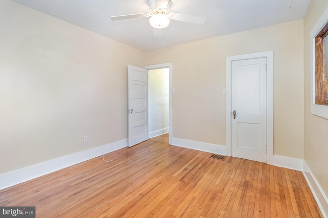 unfurnished room with ceiling fan and light hardwood / wood-style flooring