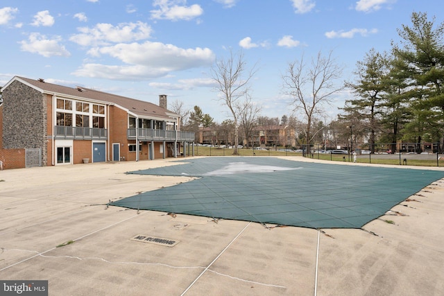 view of swimming pool featuring a patio