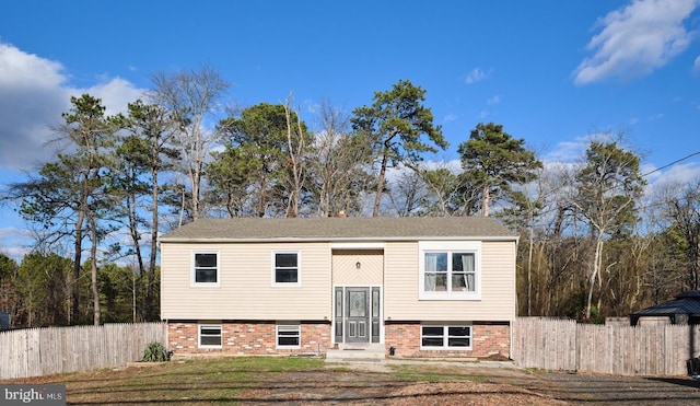 bi-level home with a front yard