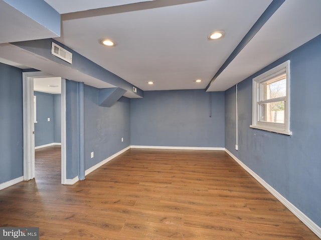 basement featuring hardwood / wood-style floors