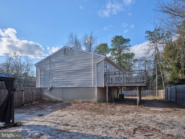 view of side of home featuring a deck