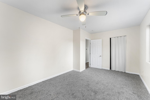 unfurnished bedroom featuring carpet, ceiling fan, and a closet