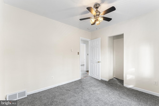 unfurnished bedroom featuring ceiling fan and carpet floors