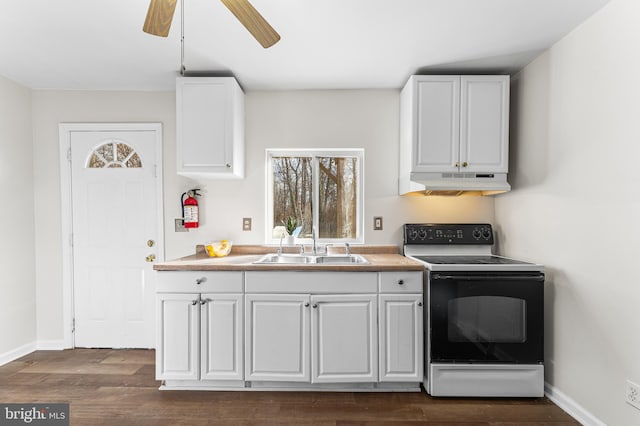 kitchen with sink, ceiling fan, range with electric stovetop, dark hardwood / wood-style flooring, and white cabinetry