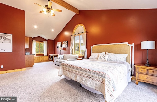 carpeted bedroom with beam ceiling, ceiling fan, and high vaulted ceiling