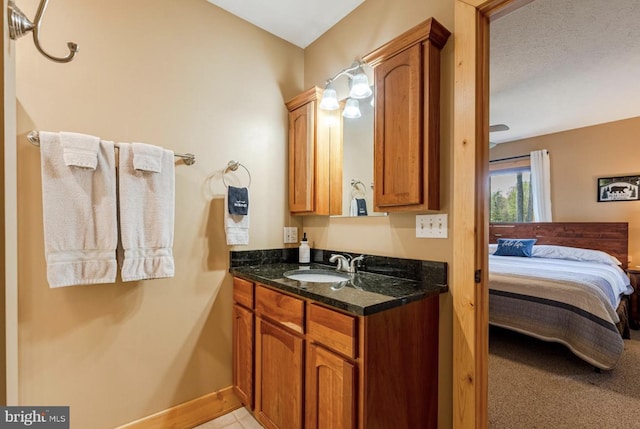 bathroom with a textured ceiling and vanity